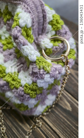 A colorful knitted fabric texture suitable for home decor, fashion, or textile 136043431