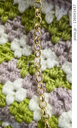A colorful knitted fabric texture suitable for home decor, fashion, or textile 136043437