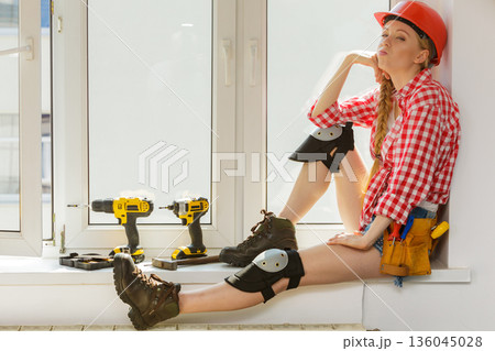 Girl using some power tools for work at home Girl using some power tools for work at home 136045028