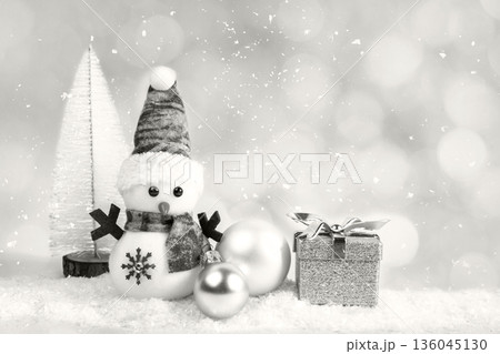 Snowman scene with festive hat, scarf, ornaments, and gift box for Christmas family cheer Demonstration Color of the Year 2026 Snowman scene with festive hat, scarf, ornaments, and gift box for Christmas family cheer Demonstration Color of the Year 2026 136045130