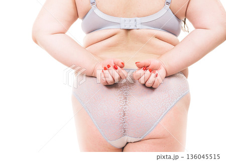 Plus size woman in lingerie back view. 136045515