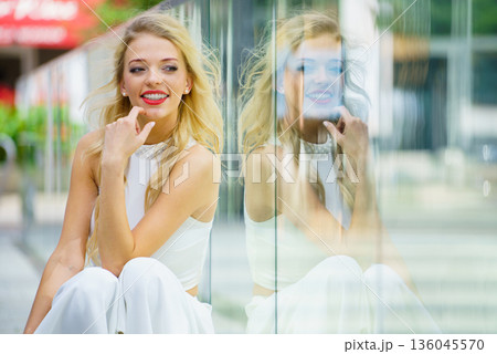 Fashionable woman in city 136045570
