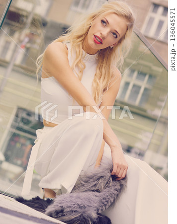 Woman wearing crop top and culottes Woman wearing crop top and culottes 136045571