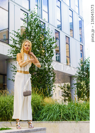 Woman wearing crop top and culottes 136045573