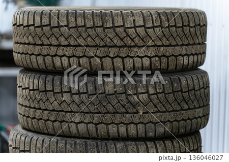 A stack of winter tires stacked on top of each other 136046027
