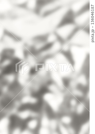 Soft gray abstract leaves pattern background with blurred silhouettes for serene nature mood. Demonstration Color of the Year 2026. 136046187