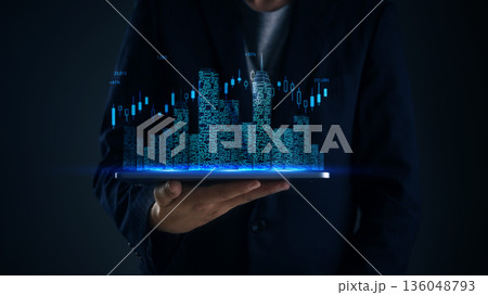 Business person holds hologram city above device to monitor real estate stock trends with data visualization candlesticks for smart city development planning and financial technology insights. Business person holds hologram city above device to monitor real estate stock trends with data visualization candlesticks for smart city development planning and financial technology insights. 136048793