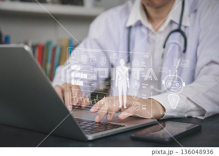 Telemedicine, physician reviews AI driven health data on holographic interface beside smartphone, inside hospital office to enhance outcomes. concept EHR, decision support, smart hospital. 136048936
