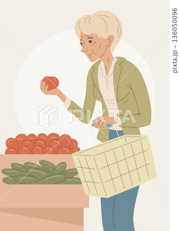Senior woman choosing fresh vegetables in grocery store 136050096