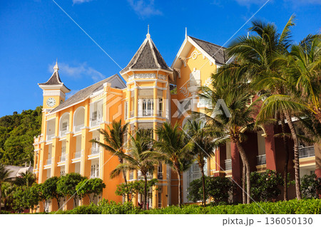 A large building with a clock tower and a balcony A large building with a clock tower and a balcony 136050130