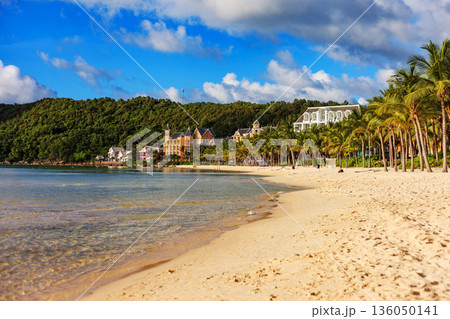 A beach with a house in the background A beach with a house in the background 136050141
