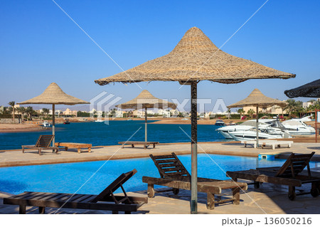 El Gouna Egypt 2.11.2025. A beach with a pool and umbrellas 136050216