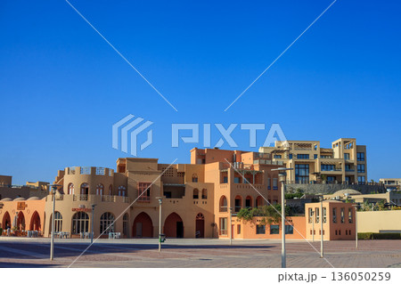 El Gouna Egypt 2.11.2025. A row of buildings with a blue sky in the background El Gouna Egypt 2.11.2025. A row of buildings with a blue sky in the background 136050259