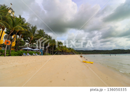 Iceland Phu Quoc Vietnam 5.7.2025. A beach with a few people and a yellow kayak Iceland Phu Quoc Vietnam 5.7.2025. A beach with a few people and a yellow kayak 136050335