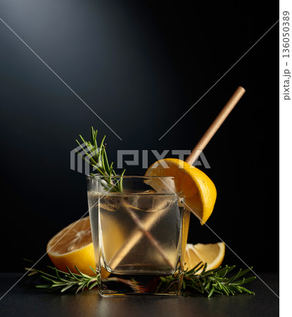 Cold refreshing drink with ice, lemon, and rosemary. 136050389