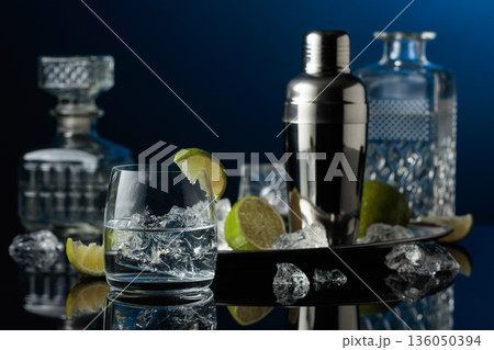 Vodka or gin in a glass with ice. Vodka or gin in a glass with ice. 136050394