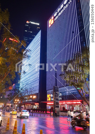 Chongqing China 4.7.2025. A city street at night with a bank building in the background Chongqing China 4.7.2025. A city street at night with a bank building in the background 136050449
