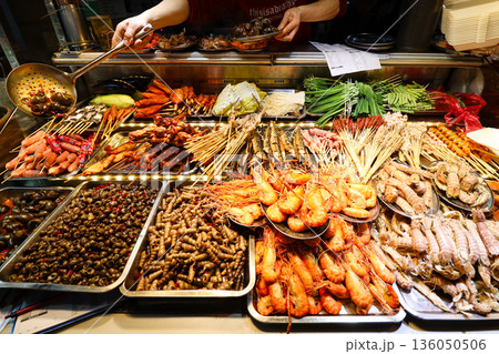 A variety of seafood and vegetables are displayed on a table A variety of seafood and vegetables are displayed on a table 136050506