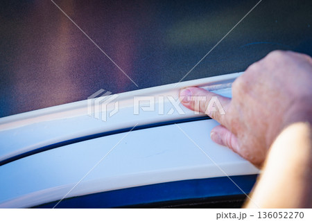 Applying silicon on caravan body 136052270