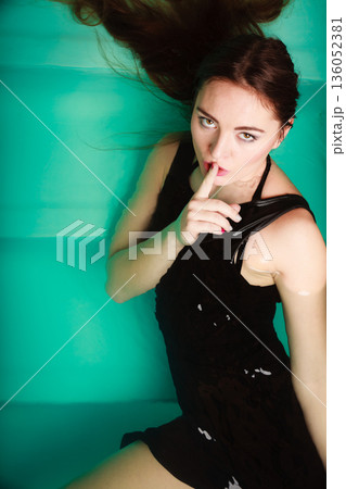 Sexy woman in water with finger silence sign. 136052381