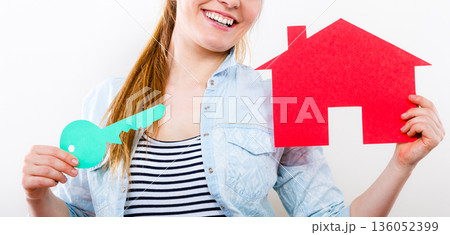 Woman and paper house. Housing real estate concept Woman and paper house. Housing real estate concept 136052399