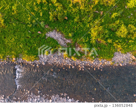 Beautiful morning view in Indonesia, panoramic landscape of rice fields with mountain ranges and clear sky 136052848