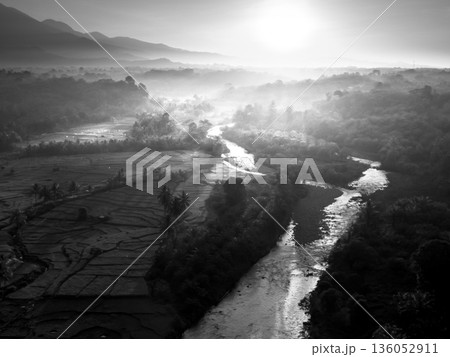 Beautiful morning view in Indonesia, panoramic landscape of rice fields with mountain ranges and clear sky 136052911