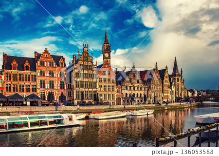 Ghent city historical center, tourists boats and colorful buildings on Leie river bank, Belgium Ghent city historical center, tourists boats and colorful buildings on Leie river bank, Belgium 136053588