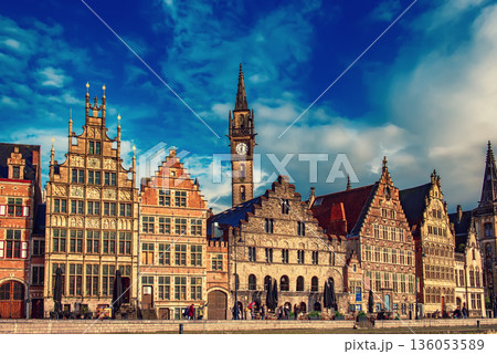 Ghent city historical center, tourists boats and colorful buildings on Leie river bank, Belgium 136053589