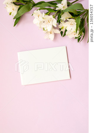 Blank card on pink background with alstroemeria flowers Blank card on pink background with alstroemeria flowers 136054357