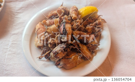 Fried calamari with lemon 136054704