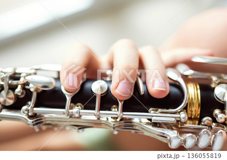 close up of child's hands playing clarinet, selective focus 136055819