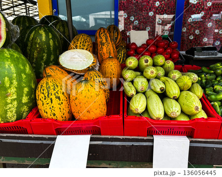 Crates of fresh fruit and vegetables are for sale on farmer market. Buying vegetables and fruits. 136056445