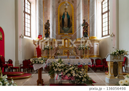 altar in catholic cathedral beautifully decorated with flowers altar in catholic cathedral beautifully decorated with flowers 136056498