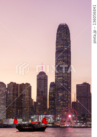Hong Kong city skyline at sunset with glowing sky and skyscrapers Hong Kong city skyline at sunset with glowing sky and skyscrapers 136056841