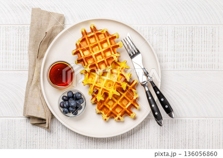 Homemade waffles with maple syrup Homemade waffles with maple syrup 136056860