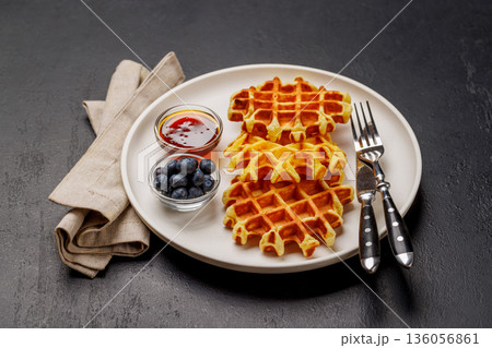 Homemade waffles with maple syrup 136056861