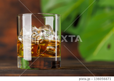 Glass of whiskey with ice Glass of whiskey with ice 136056871