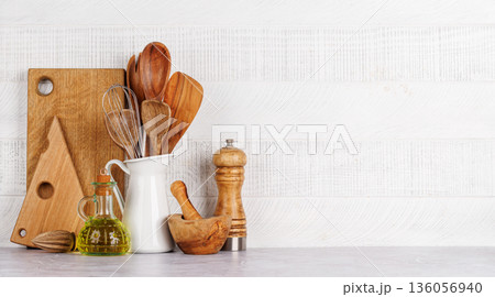 Kitchen utensils and spices on table 136056940