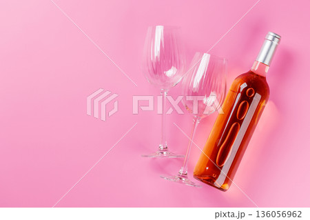 Rose wine and wine glasses on pink background Rose wine and wine glasses on pink background 136056962