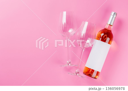 Rose wine and wine glasses on pink background Rose wine and wine glasses on pink background 136056978