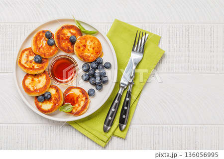 Homemade pancakes with blueberries and syrup 136056995