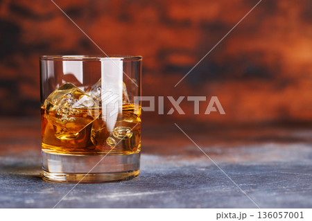 Glass of whiskey with ice 136057001