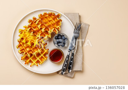 Homemade waffles with maple syrup 136057028