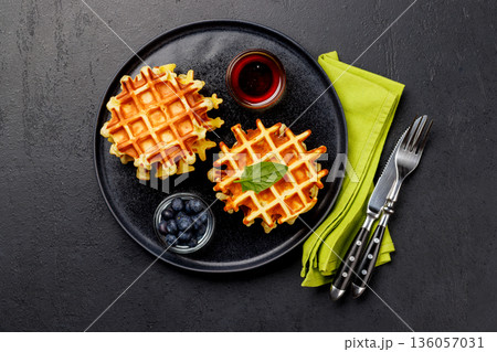 Homemade waffles with maple syrup Homemade waffles with maple syrup 136057031