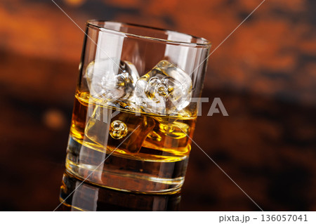 Glass of whiskey with ice 136057041