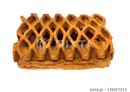 Pastry, mesh puff pastry bun with cherry filling on white background isolated Pastry, mesh puff pastry bun with cherry filling on white background isolated 136057213