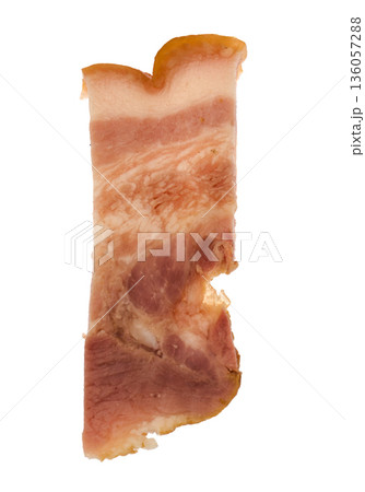 Slice of bacon with meat layers on white plate isolated 136057288