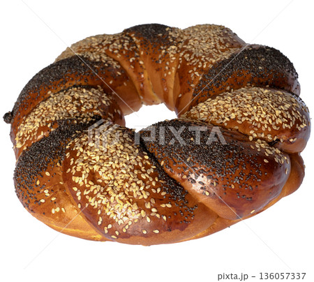 Sweet Slavic bun made in the form of a ring, and called Kalach, on a white background in isolation 136057337