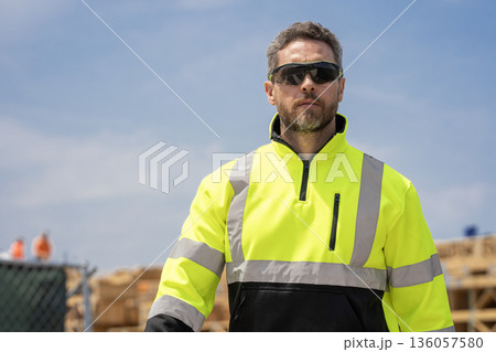 Builder construction man. Worker supervisor heavy machinery. Safety inspection. Man at construction site. Civil construction engineering. Man engineer at building site. Copy space 136057580